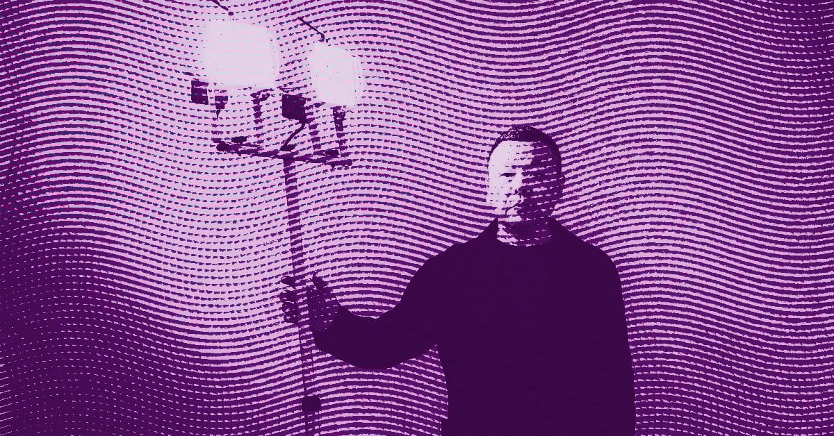 A person holding a three-light chandelier stands against a wavy, patterned background. The entire image has a purple hue and a halftone texture effect. © Illustration by ArtCritic.