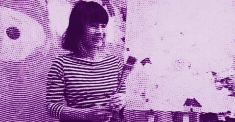 A person with shoulder-length hair wearing a striped shirt stands in front of a light background. The image is edited with a purple halftone effect, giving it a textured, artistic appearance. © Illustration by ArtCritic.