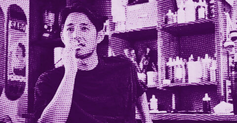 A man sits indoors, thoughtfully resting his hand on his chin. The image has a purple halftone effect, with shelves of bottles and containers visible in the background. © Illustration by ArtCritic.