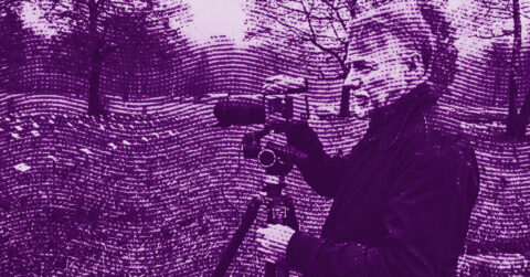 A person stands outdoors, operating a camera on a tripod. The image has a strong purple and pink filter with a wavy, textured overlay. Leafless trees and grass are visible in the background. © Illustration by ArtCritic.