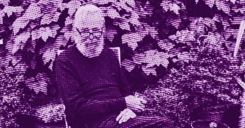 A bearded person with glasses sits outdoors on a chair, surrounded by leafy plants. The image has a purple halftone effect, giving it a stylized, textured look. © Illustration by ArtCritic.