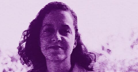 A stylized purple-toned halftone image of a person with shoulder-length hair, looking forward, set against a light background. © Illustration by ArtCritic.