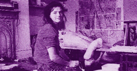 A person with long hair sits sideways at a cluttered desk in a room, looking toward the camera. The image has a purple, halftone pattern overlay that creates a textured, stylized effect. © Illustration by ArtCritic.