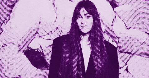 A woman with long hair wearing a jacket stands against an abstract, textured background. The image features a purple color scheme and a halftone dot pattern effect, giving it a stylized, graphic appearance. © Illustration by ArtCritic.