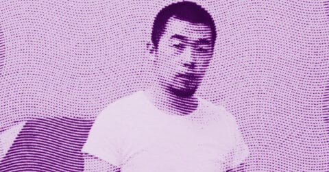 A stylized, purple-tinted image of Zhao Zhao with short hair and a beard, wearing a light-colored shirt. The image is overlaid with wavy, dotted lines, creating a textured, abstract effect. © Illustration by ArtCritic.