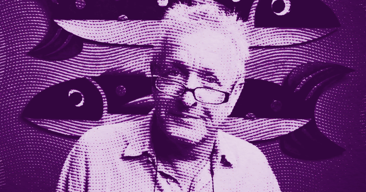 Graham Knuttel with glasses sits in front of a wall with large fish illustrations. The image has a purple color filter and a dotted texture overlay. © Illustration by Art Critic.