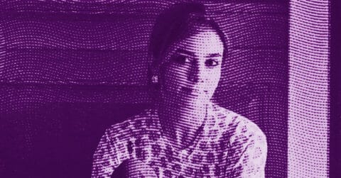 Anna Weyant sits indoors, looking at the camera. The image is filtered with a purple hue and overlaid with curved, wavy dotted lines, creating an abstract, artistic effect. © Illustration by Art Critic.