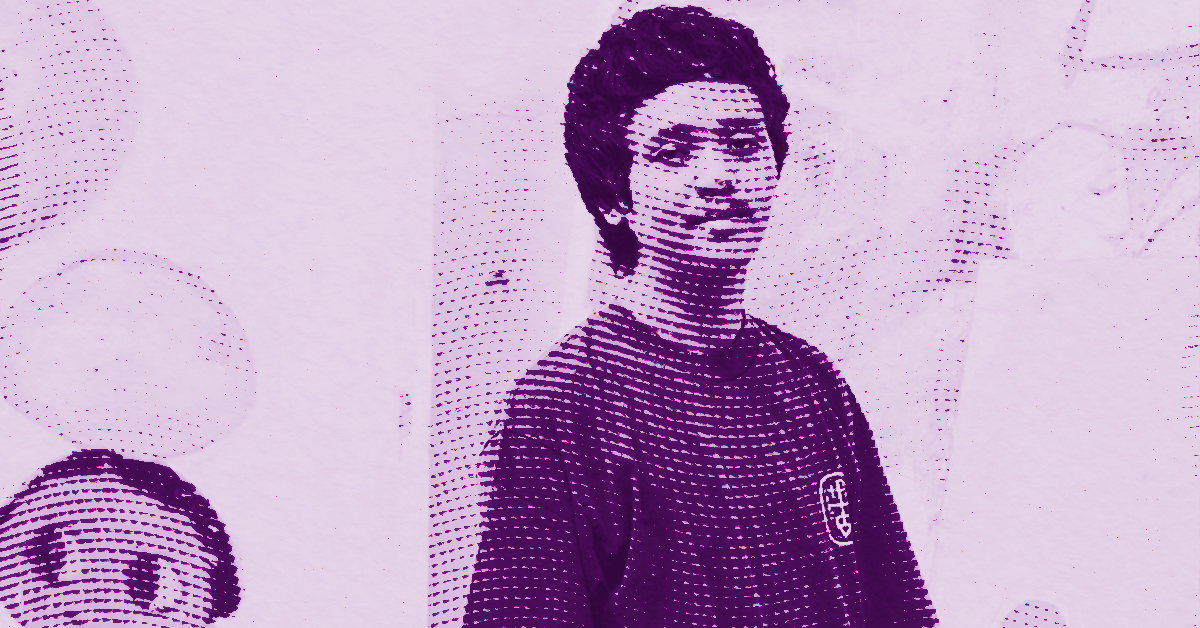 Roby Dwi Antono with short, curly hair and a dark shirt stands smiling. The image uses a purple halftone effect, creating a stylized, graphic look. Background details are abstract and indistinct. © Illustration by Art Critic.