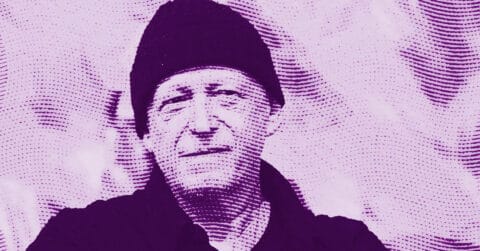 An artistic, purple-toned image of Herbert Brandl wearing a dark beanie and shirt, with a textured, dotted overlay pattern across the entire image, creating a stylized and abstract effect. © Illustration by Art Critic.
