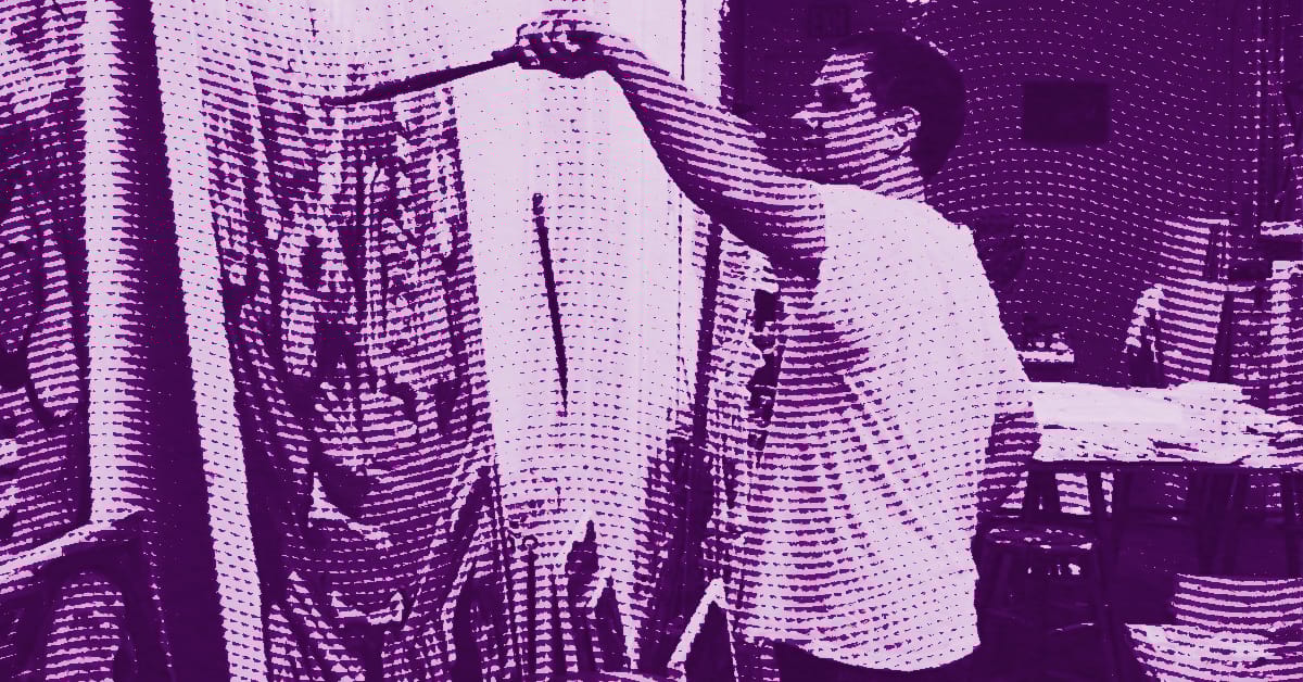 Josh Smith wearing a t-shirt stands in front of a large canvas, painting with a brush. The image has a purple filter and halftone effect, giving it a stylized, textured appearance. © Illustration by Art Critic.