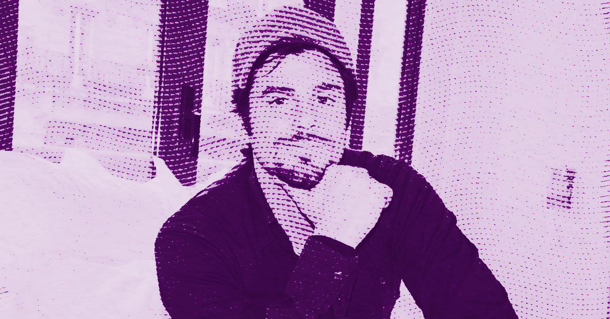 Philippe Shangti wearing a beanie and a dark shirt sits indoors with his hand resting on his chin. The photo has a purple filter and a dotted halftone effect. © Illustration by Art Critic.