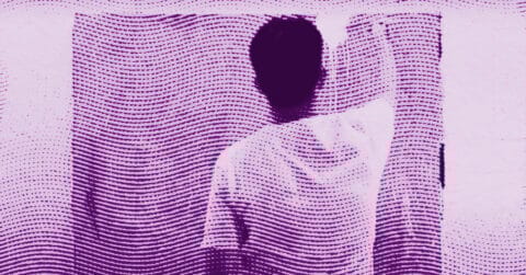 Syozo Taniguchi in a white shirt stands behind a semi-transparent screen with wavy, horizontal purple lines and dots, obscuring their face and creating an abstract, textured visual effect. © Illustration by Art Critic.