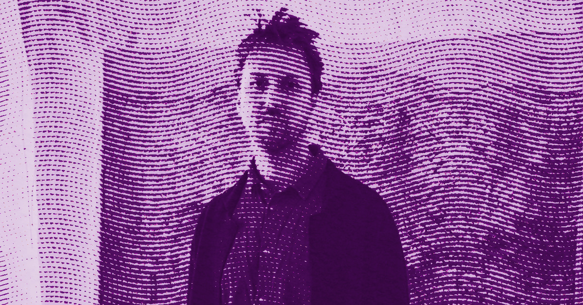 A portrait of the artist Theodore Ereira-Guyer standing against a wall, overlaid with a pattern of horizontal dotted lines. The image is tinted purple, giving it an abstract, artistic look. © Illustration by Art Critic.