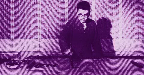 Chen Jia in glasses stands behind a table, looking down thoughtfully. The image has a purple overlay with wavy, dotted lines throughout, creating a textured, artistic effect. © Illustration by Art Critic.