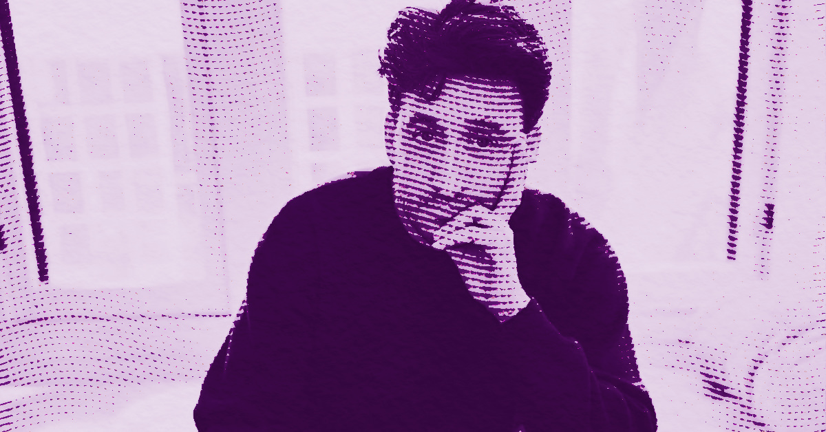 A stylized, purple-tinted image of Calvin Marcus with short dark hair resting his chin on one hand, sitting in front of light curtains. The image features a halftone dot pattern effect. © Illustration by Art Critic.