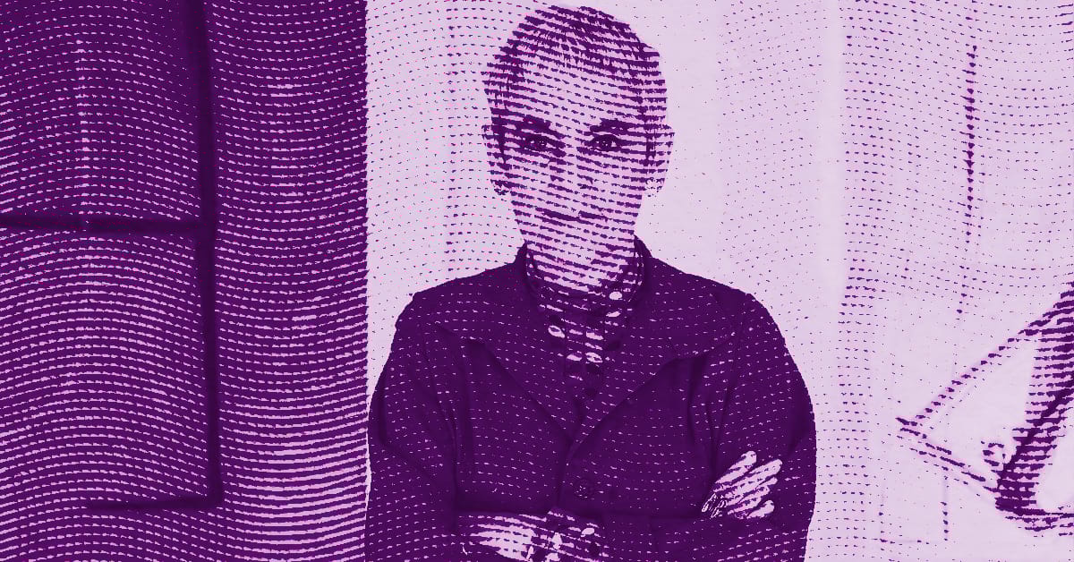 Mira Schor with short hair and glasses stands with arms crossed, facing the camera. The image is tinted purple with a dotted pattern overlay, and features abstract shapes in the background. © Illustration by Art Critic.