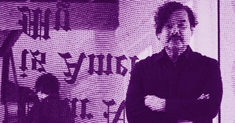 Julio César Morales stands with arms crossed in front of a wall with large, partially obscured text. The image is overlaid with a wavy, dotted pattern and tinted purple, creating a stylized, abstract effect. © Illustration by Art Critic.