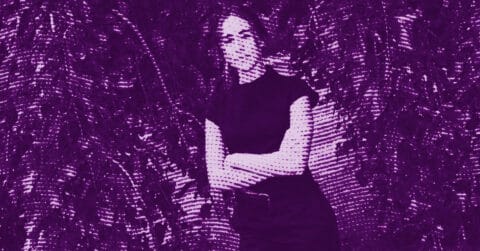 Nour Jaouda with long hair stands with arms crossed, wearing a short-sleeve top and pants. The image has a purple color filter and a halftone dot effect, with leafy foliage in the background. © Illustration by Art Critic.